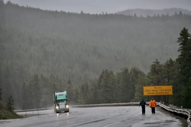 Walking in the rain on the road to Montana, 2007